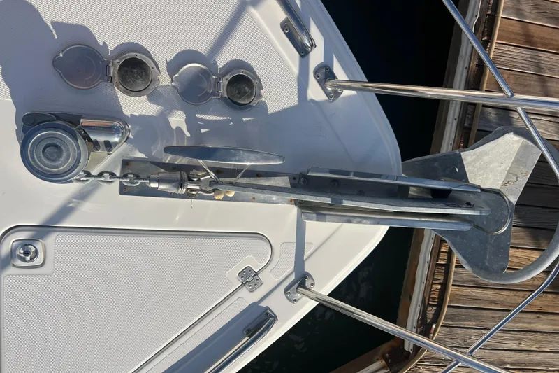 Slide: The Image of Anchor system on 2004 Carver 466 MY yacht, docked with visible chain and winch. - 22