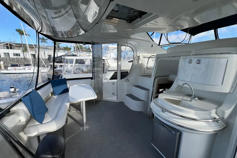 Slide: The Image of Luxurious interior of 2004 Carver 466 MY yacht with seating and kitchenette. - 4