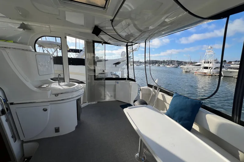 Slide: The Image of Interior view of 2004 Carver 466 MY yacht with marina backdrop. - 5