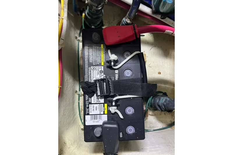 Slide: The Image of Battery compartment of a 2004 Carver 466 Motor Yacht with secured cables. - 50