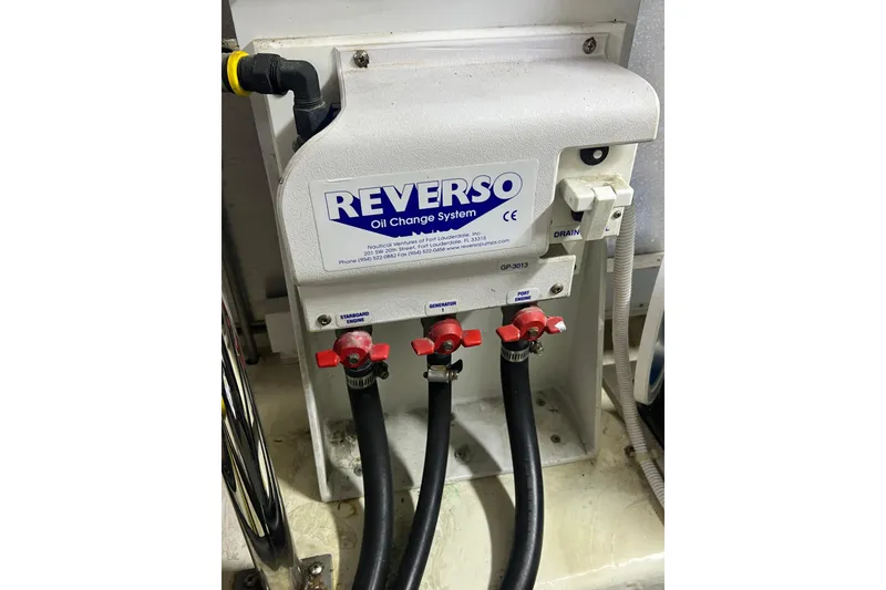 Slide: The Image of Reverso oil change system in a 2004 Carver 466 MY boat engine room. - 54