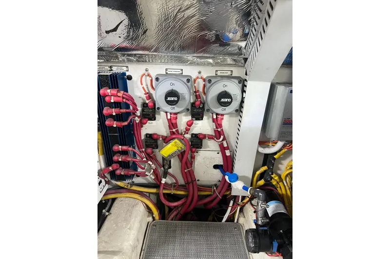 Slide: The Image of Electrical system of a 2004 Carver 466 MY boat with wiring and switches. - 56