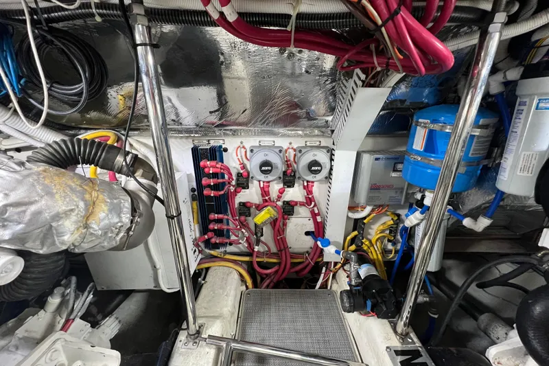 Slide: The Image of Engine room of a 2004 Carver 466 MY yacht with wiring and equipment. - 57