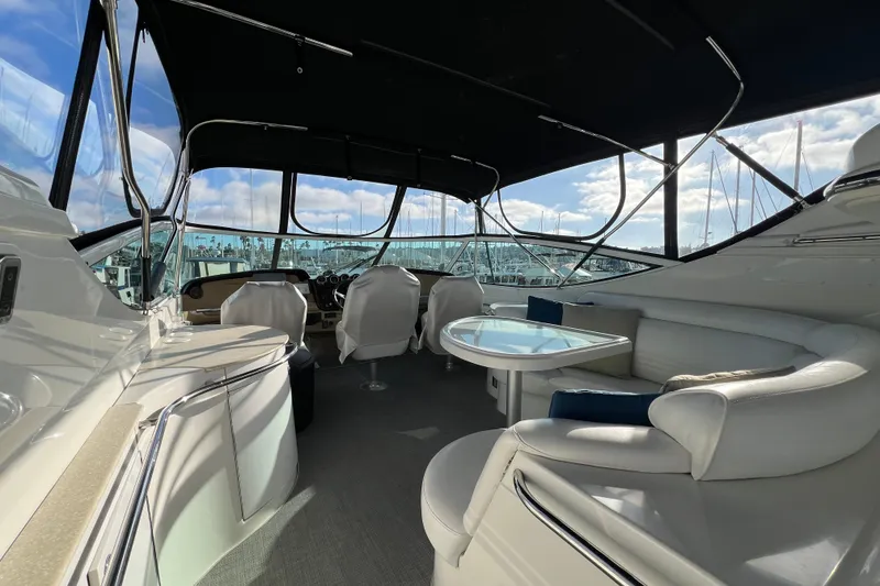 Slide: The Image of Luxurious interior of 2004 Carver 466 MY yacht with seating and table. - 6