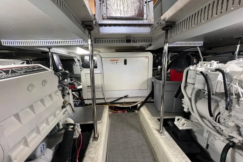 Slide: The Image of Engine room of a 2004 Carver 466 MY yacht, featuring mechanical systems and equipment. - 60