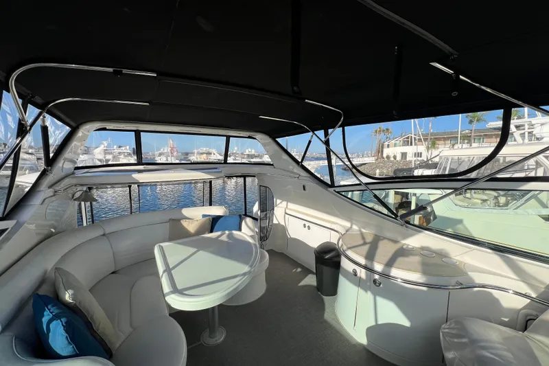 Slide: The Image of Luxurious interior of 2004 Carver 466 MY yacht with marina view. - 8