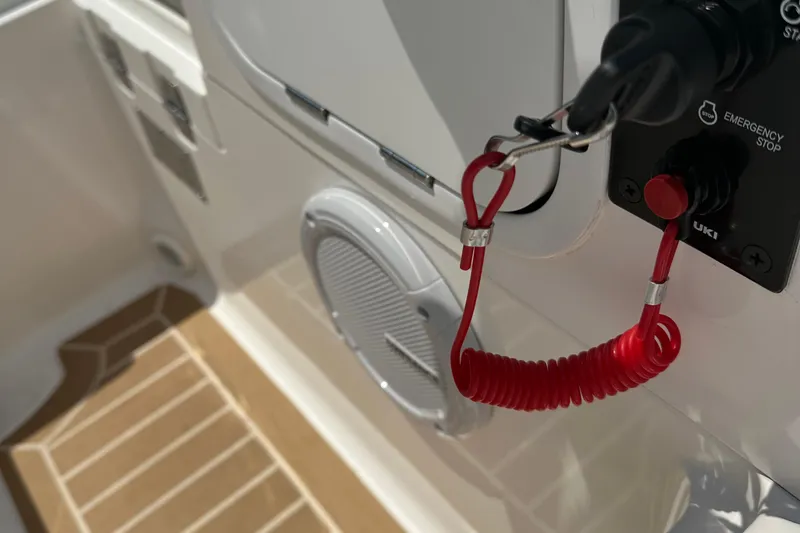 Slide: The Image of 2022 Zar Tender ZF0 boat interior with emergency stop switch and red safety cord. - 12