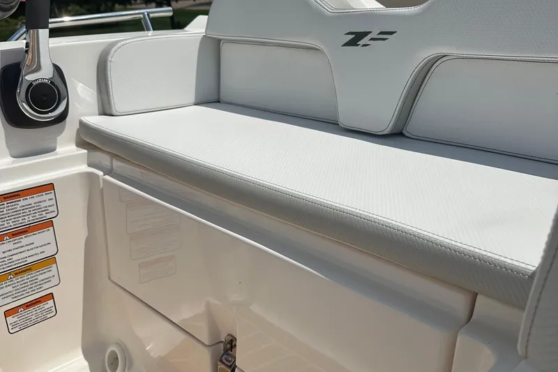 Slide: The Image of 2022 Zar Tender ZF0 boat interior with white seating and control panel. - 15