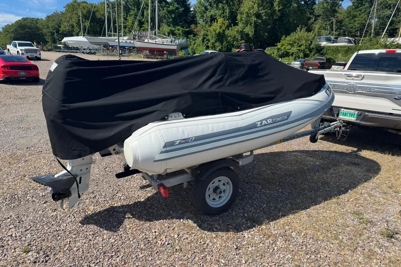 Slide: The Image of 2022 Zar Tender ZF0 boat on trailer, covered, parked outdoors. - 3