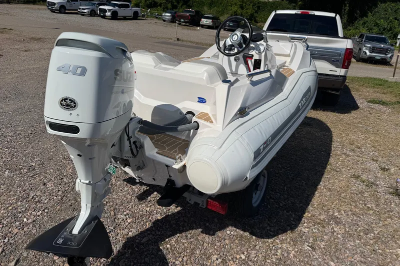 Slide: The Image of 2022 Zar Tender ZF0 boat with Suzuki 40 outboard motor on trailer. - 8