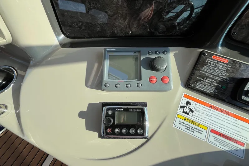 Slide: The Image of Control panel of 2006 Sea Ray 380 Sundancer with navigation and audio systems. - 13