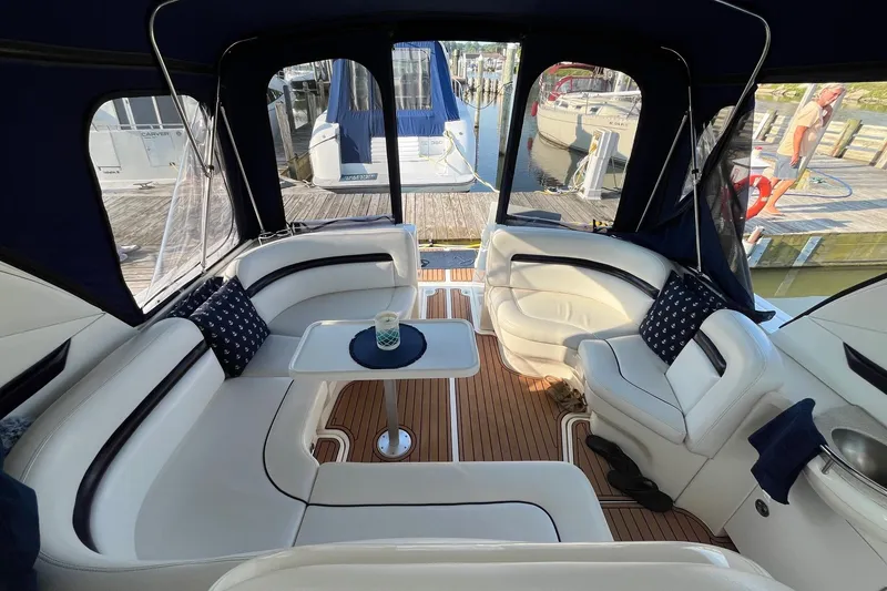 Slide: The Image of Luxurious 2006 Sea Ray 380 Sundancer yacht interior with elegant seating and table. - 21