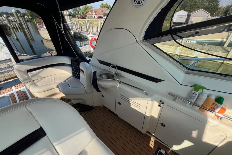 Slide: The Image of Interior of 2006 Sea Ray 380 Sundancer yacht with seating and sink area. - 22