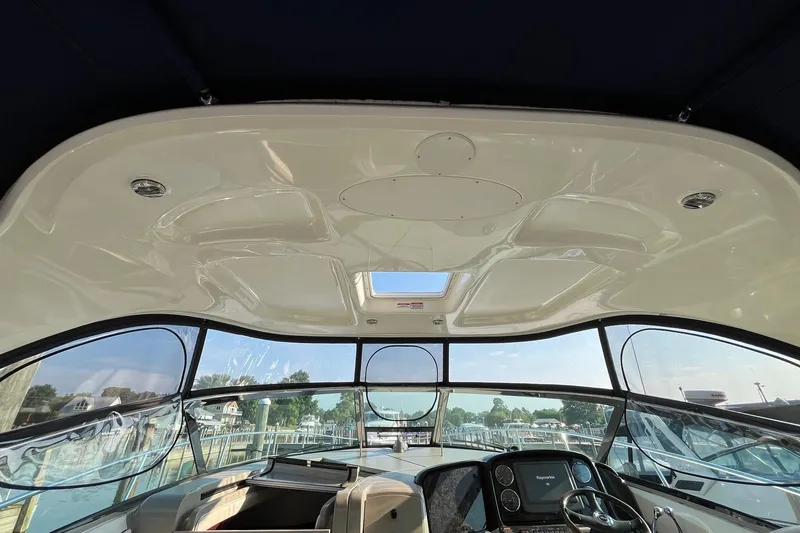 Slide: The Image of Interior view of 2006 Sea Ray 380 Sundancer boat cockpit with panoramic windows. - 24