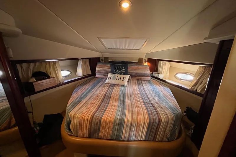 Slide: The Image of Interior of 2008 Sea Ray 38 Sundancer with beige seating and entertainment area. - 36