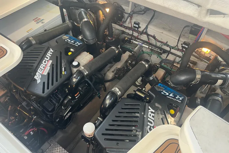 Slide: The Image of Shower area inside a 2006 Sea Ray 380 Sundancer yacht, featuring toiletries and a handheld showerhead. - 43