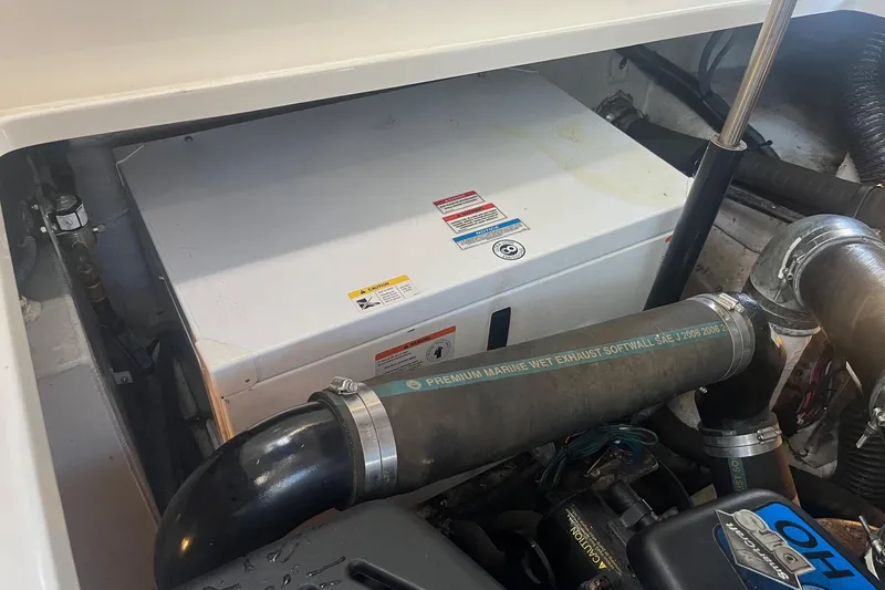 Slide: The Image of Engine compartment of a 2008 Sea Ray 380 Sundancer with visible marine exhaust system. - 46