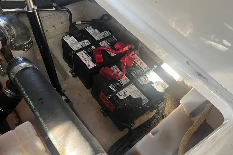 Slide: The Image of Battery compartment of a 2008 Sea Ray 380 Sundancer boat, showing multiple batteries and wiring. - 47
