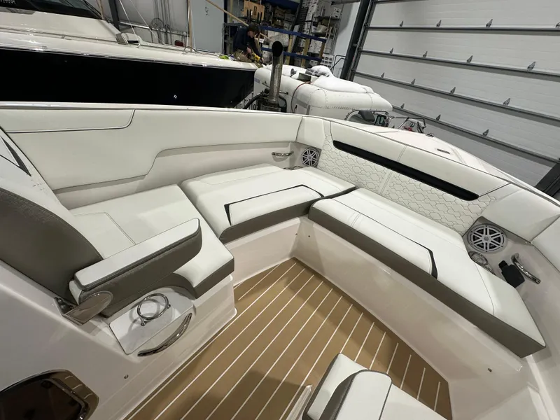 Slide: The Image of 2024 Tiara Yachts 34 LX interior with white seating and wood flooring. - 30