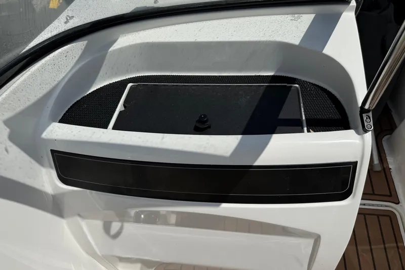 Slide: The Image of 2022 Bayliner VR4 Bowrider OB boat interior detail with storage compartment. - 12
