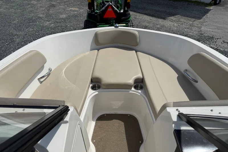 Slide: The Image of 2016 Bayliner VR5 Bowrider interior with beige seating and cup holders. - 15