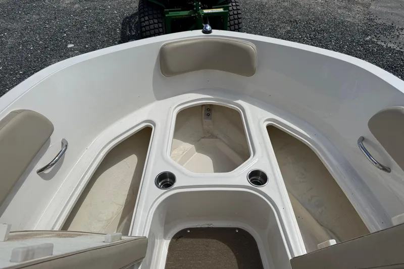 Slide: The Image of 2016 Bayliner VR5 Bowrider boat interior with seating and cup holders. - 16