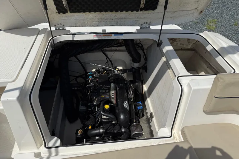 Slide: The Image of 2016 Bayliner VR5 Bowrider engine compartment with MerCruiser engine visible. - 9