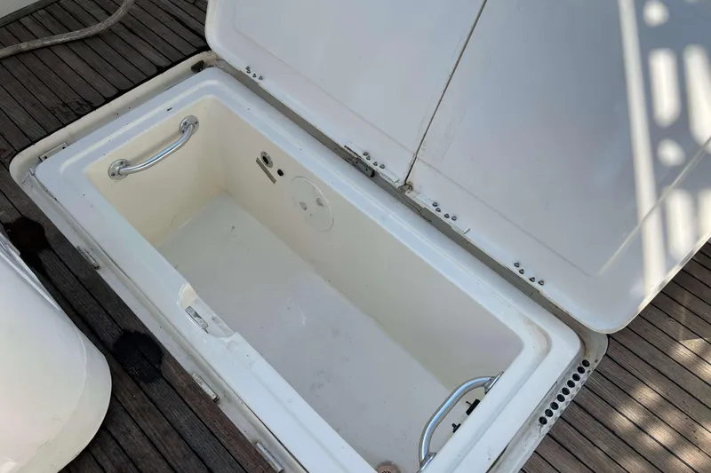 Slide: The Image of Interior detail of a 2007 Henriques 42 Express boat, featuring a metal handle and circular fittings. - 12