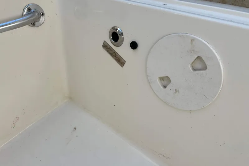 Slide: The Image of 2007 Henriques 42 Express boat deck with wooden flooring and white storage compartments. - 13