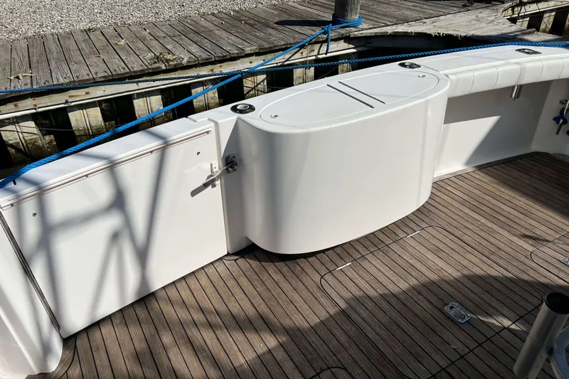 Slide: The Image of Open storage compartment on 2007 Henriques 42 Express boat deck with equipment inside. - 14