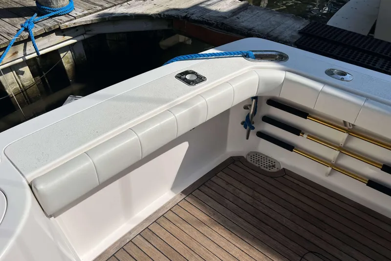 Slide: The Image of Teak deck of 2007 Henriques 42 Express boat with metal fittings and shadows. - 22