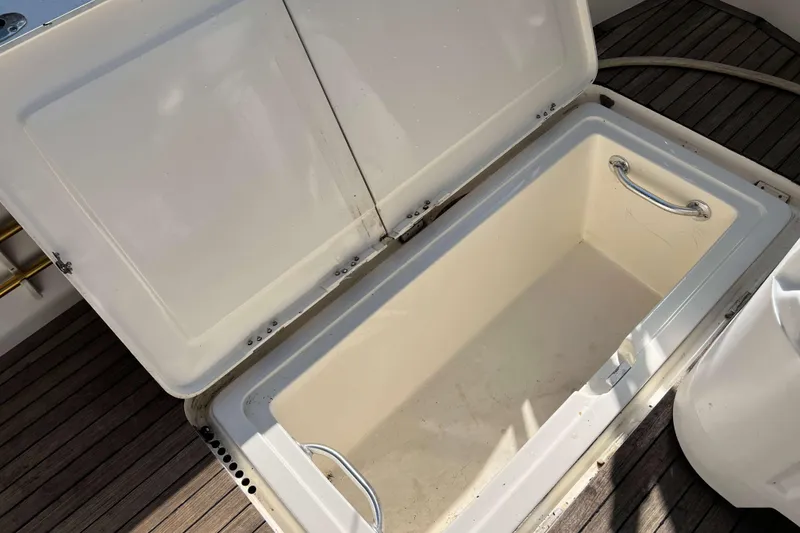 Slide: The Image of Henriques 42 Express 2007 boat deck with rod holders and teak flooring. - 24