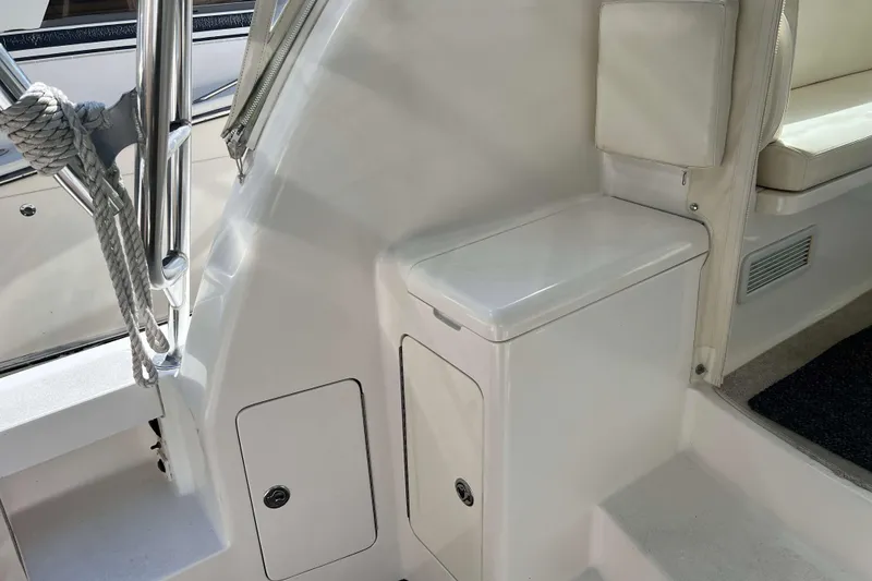 Slide: The Image of 2007 Henriques 42 Express boat interior with helm, seating, and navigation equipment. - 27