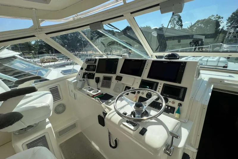 Slide: The Image of 2007 Henriques 42 Express boat interior with cup holders and speaker. - 34