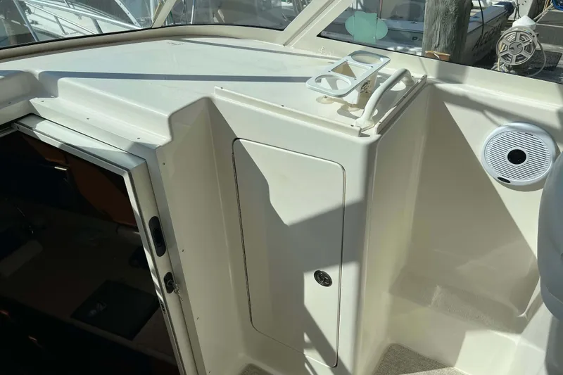 Slide: The Image of 2007 Henriques 42 Express galley with microwave, sink, and compact appliances. - 35