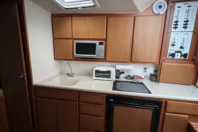 Slide: The Image of Bathroom interior of 2007 Henriques 42 Express yacht with sink and toilet. - 37