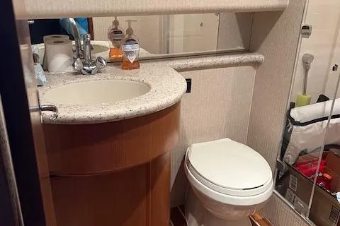 Slide: The Image of 2007 Henriques 42 Express cabin with wooden table and beige seating. - 38