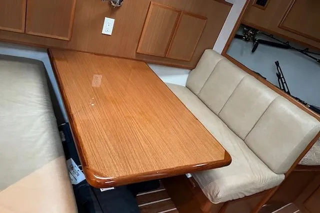 Slide: The Image of Interior cabin of 2007 Henriques 42 Express with bed and striped pillows. - 39