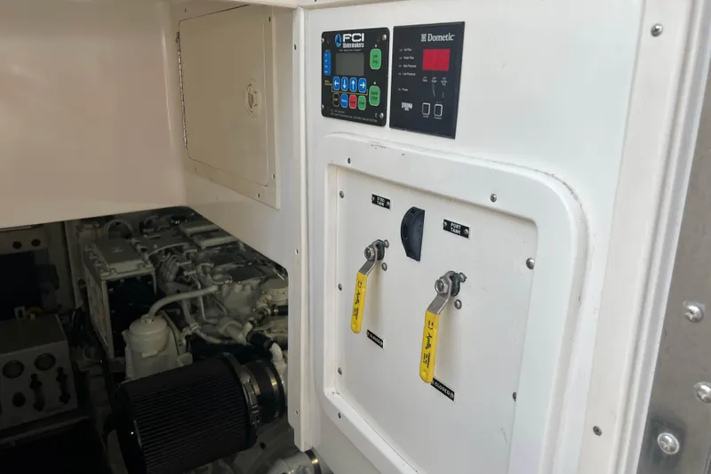Slide: The Image of Engine room of a 2007 Henriques 42 Express boat, showcasing dual engines and equipment. - 46