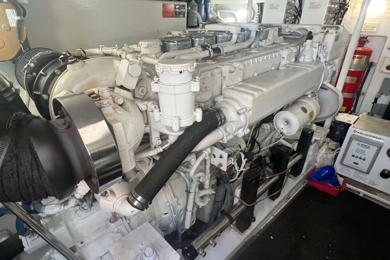 Slide: The Image of Engine room of a 2007 Henriques 42 Express boat, showcasing detailed machinery. - 51