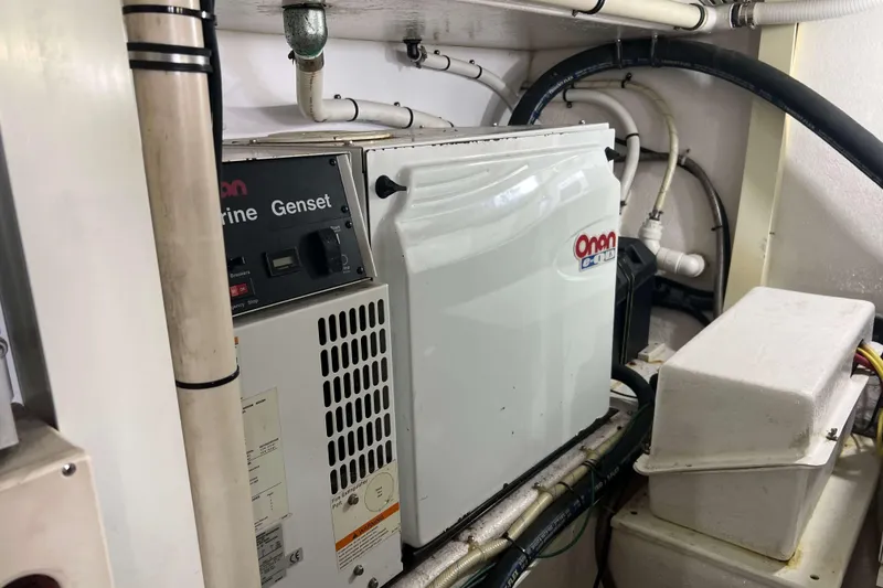 Slide: The Image of Engine room of 2007 Henriques 42 Express boat with visible wiring and machinery. - 60