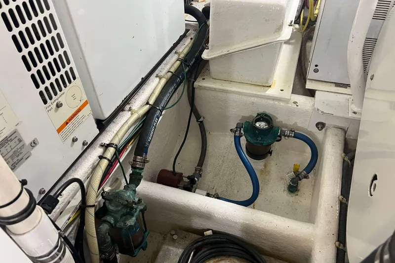 Slide: The Image of Engine compartment of a 2007 Henriques 42 Express with hoses and components. - 61