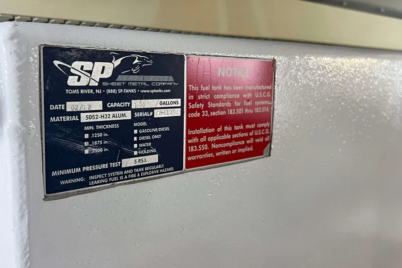 Slide: The Image of Engine room of a 2007 Henriques 42 Express boat, showcasing machinery and components. - 66