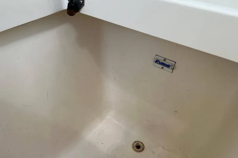 Slide: The Image of 2007 Henriques 42 Express boat deck with cleaning tools and accessories. - 7