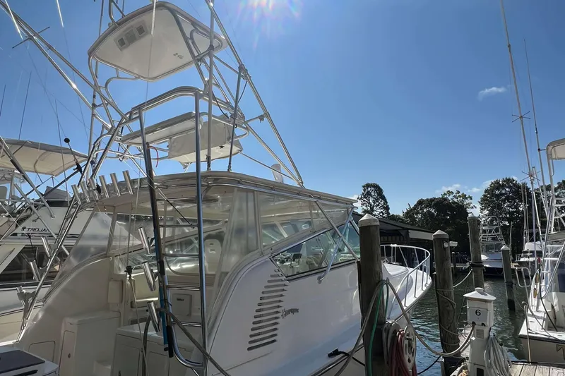 Slide: The Image of 2007 Henriques 42 Express boat deck with hatches and life raft, docked at marina. - 77