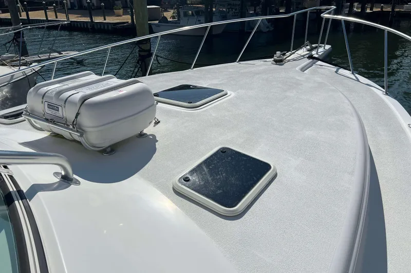 Slide: The Image of Bow of 2007 Henriques 42 Express boat with anchor chain and railings. - 78