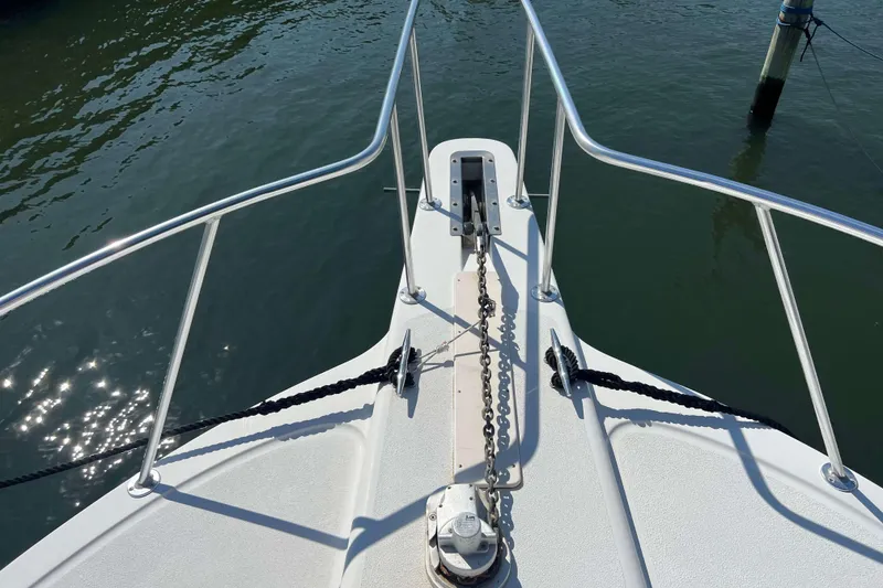 Slide: The Image of 2007 Henriques 42 Express boat docked, featuring radar equipment and fishing tower. - 79
