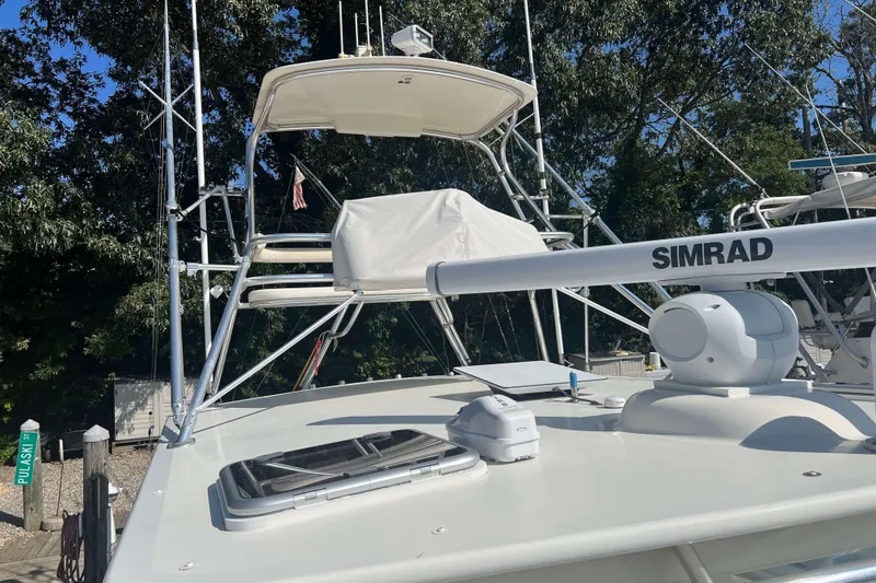 Slide: The Image of Henriques 42 Express 2007 yacht cruising at sunset on the ocean. - 81