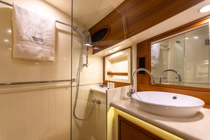 Slide: The Image of Luxurious bathroom in 2021 Palm Beach Motor Yachts PB65, featuring modern fixtures and elegant design. - 23