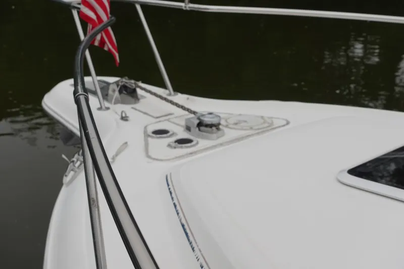Slide: The Image of Bow of a 1997 Sea Ray 270 Sundancer with American flag and anchor chain. - 3
